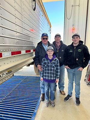 family standing next to semi