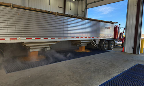 grain trailer dumping corn
