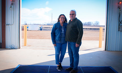 two people inside a new grain facility